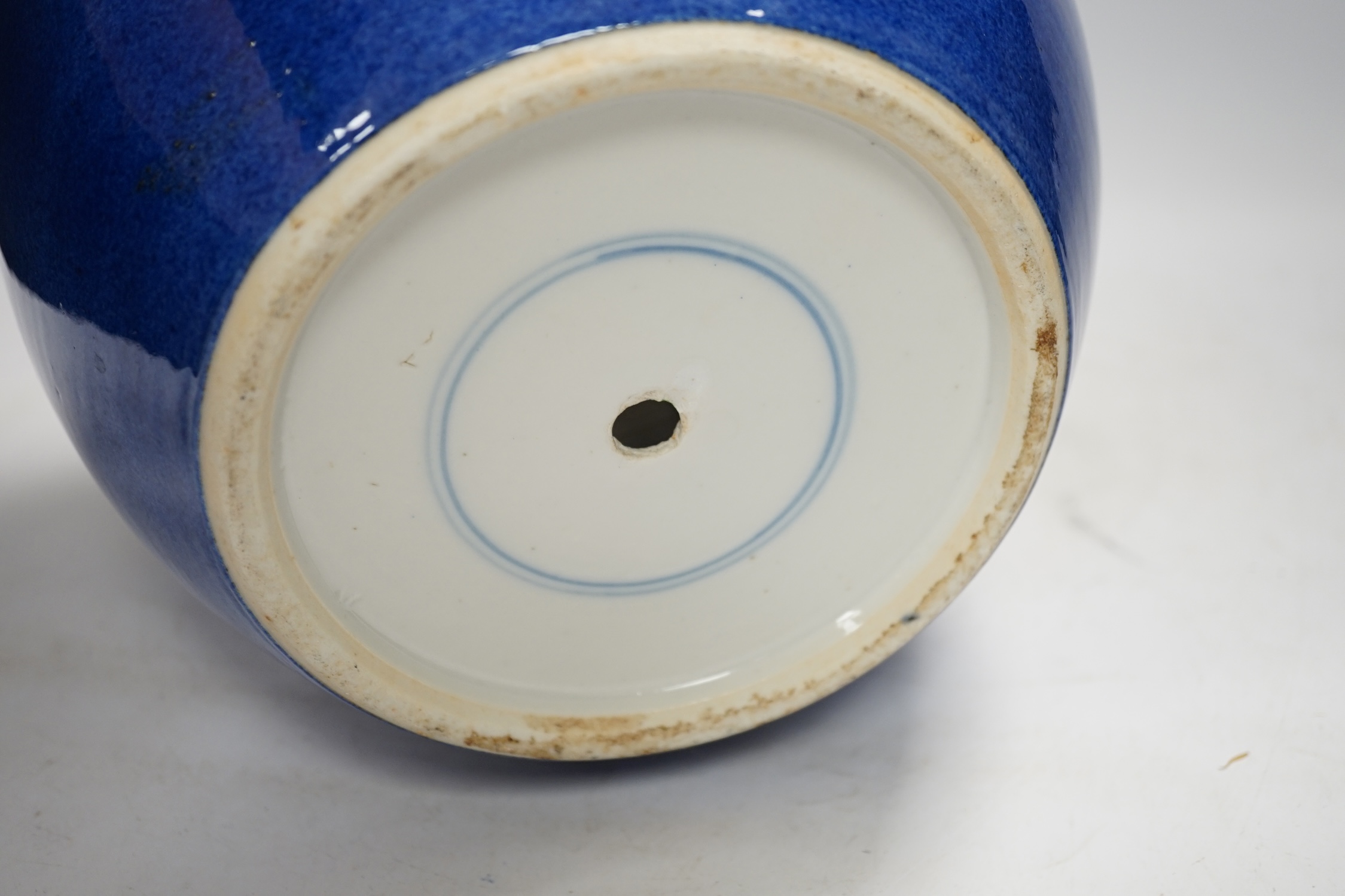 A Chinese powder blue jar, late 19th century, drilled hole to base and a turquoise glazed ground jar, blue vase 22cm high. Condition - turquoise jar cracked and chipped